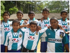 Children at Ulapane school wearing the donated team strips